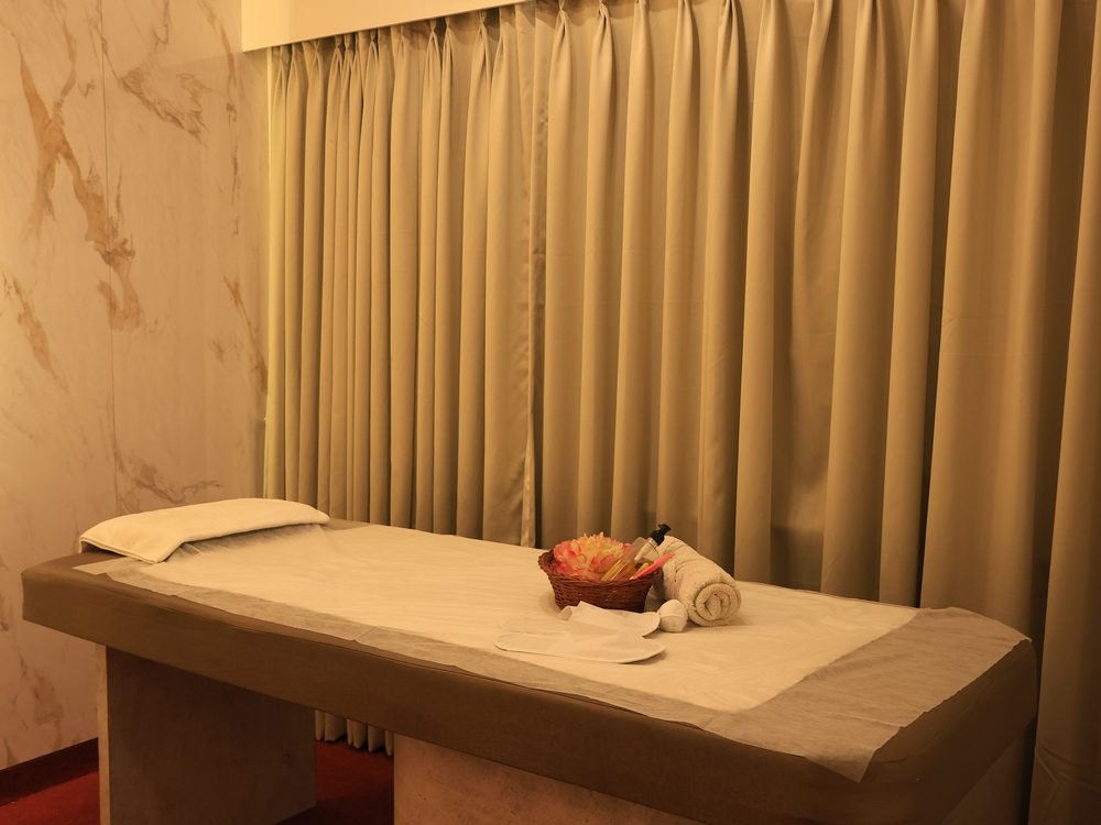 Private air-conditioned massage room with marble walls at Urban Luxury Spa Juhu