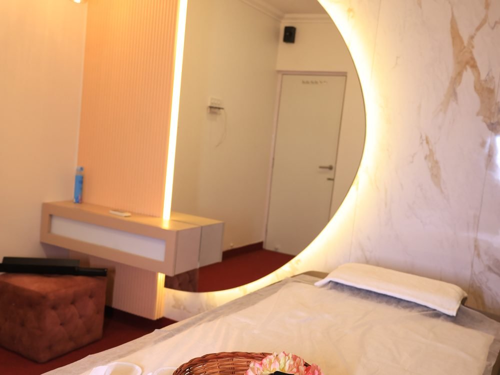 Deluxe therapy suite with backlit mirror at Urban Luxury Spa Juhu