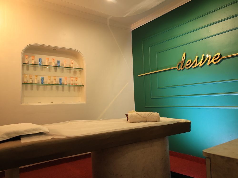 Massage room stocked with fresh skincare products