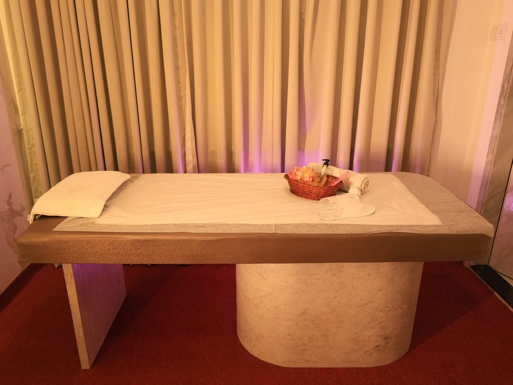 Serene private massage room with soft lighting